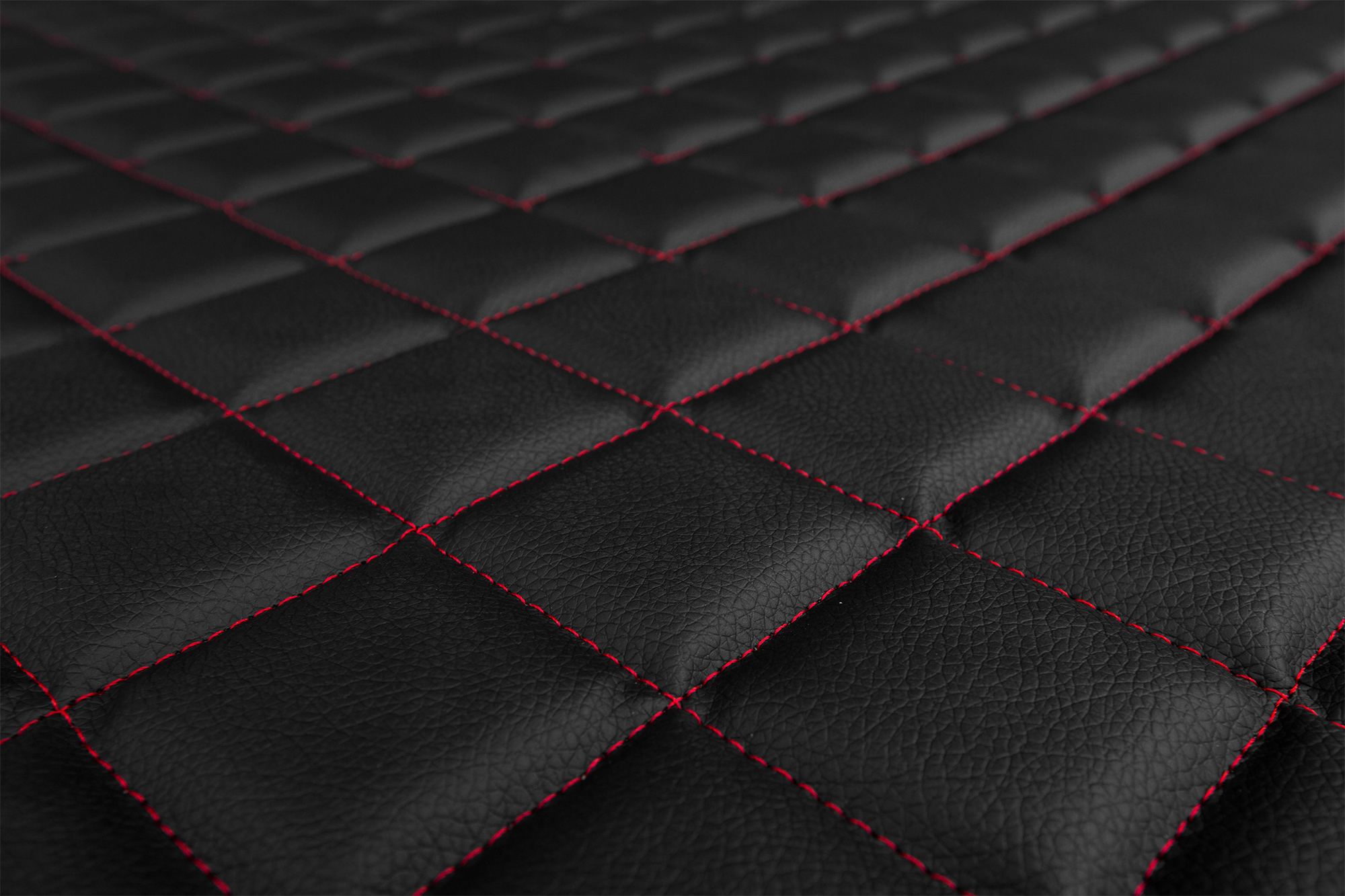 Detalle de la superficie y del acolchado de las fundas ELEGANCE Q: Negro y rojo